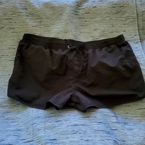 Black swim shorts NEW. Has built in swim brief with hygiene liner still in place